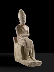 Seated statue of Pharaoh Khasekhem with conquered foes incised around the base, Hierakonpolis, c.2700 BC